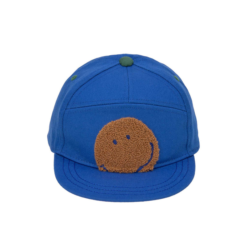 casquette bleu avec smiley de lassig